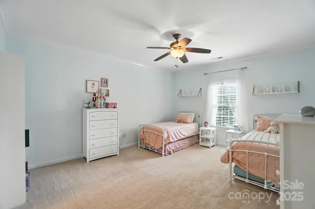 a spacious bedroom with a bed and a window