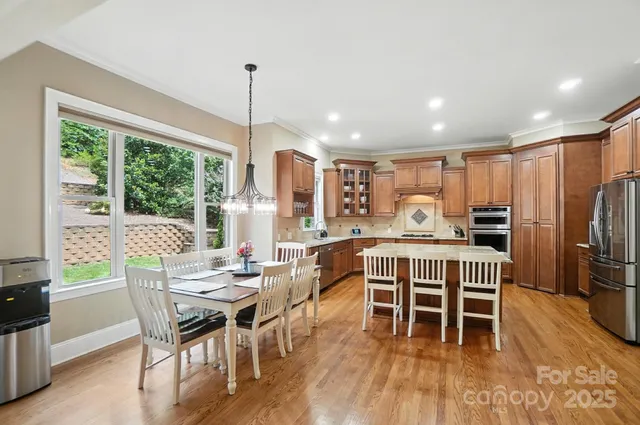 a view of a dining room with furniture window and outside view
