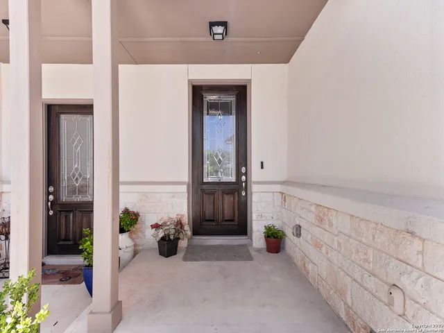 a view of an entryway with wooden floor