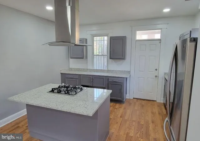 a kitchen with a sink appliances and cabinets