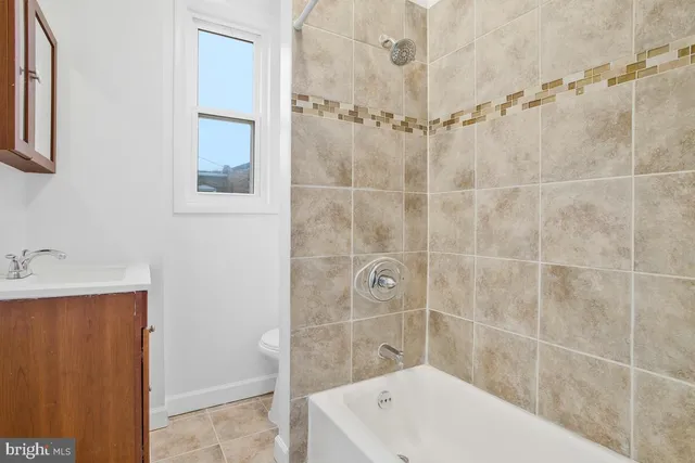 a bathroom with a shower and a bathtub