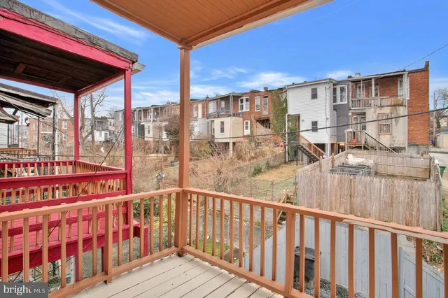 a view of a balcony with furniture