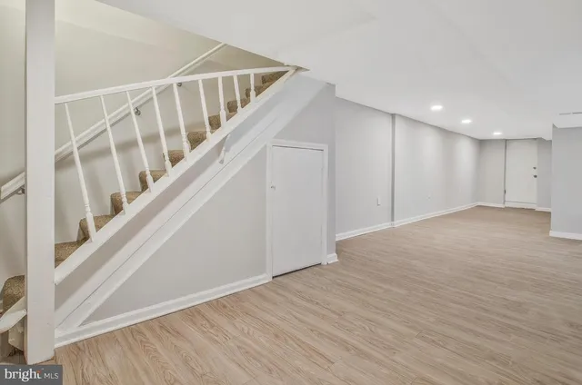 a view of an entryway with wooden floor