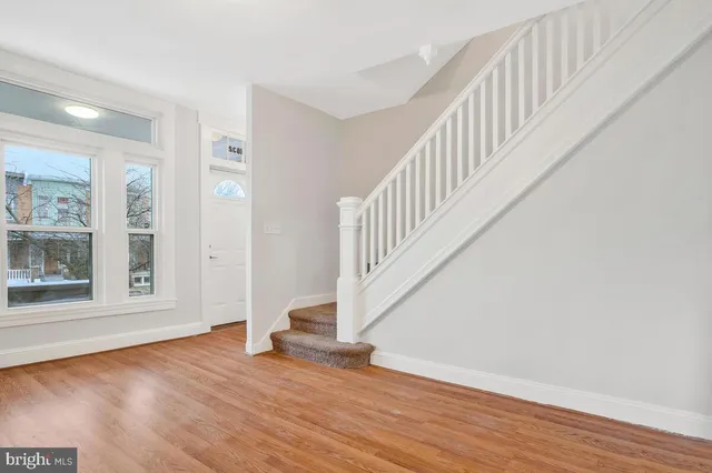 a view of an entryway with wooden floor
