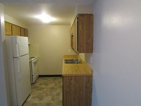 82 East Hayden Avenue, Unit 8 Evanston, WY 82930 - Photo 6 of 8 a utility room with a sink dryer and washer