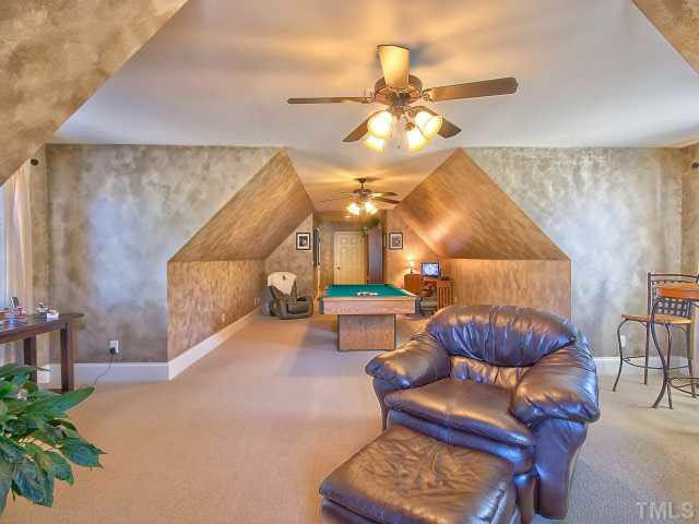 9705 Bailey Grove Court Raleigh, NC 27613 - Photo 17 of 25 Massicve bonus room on second level has peaked ceilings, dual ceiling fans and a massive walk in closet.