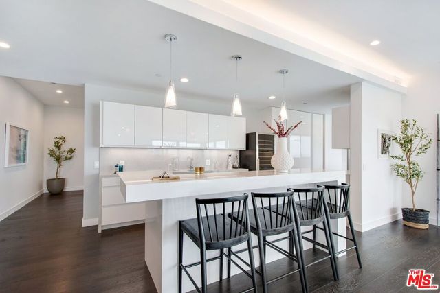 a kitchen with a table and chairs in it