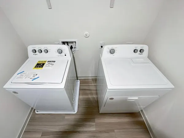 a utility room with dryer and washer