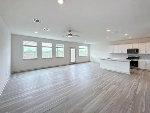 a view of a kitchen with microwave and cabinets