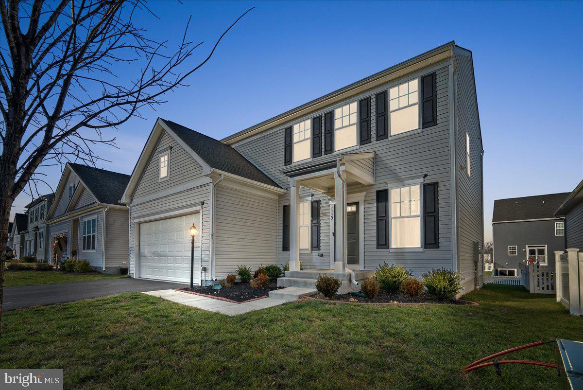 115 Interlace Way Stephenson, VA 22656 - Photo 1 of 45 a front view of a house with a yard and garage