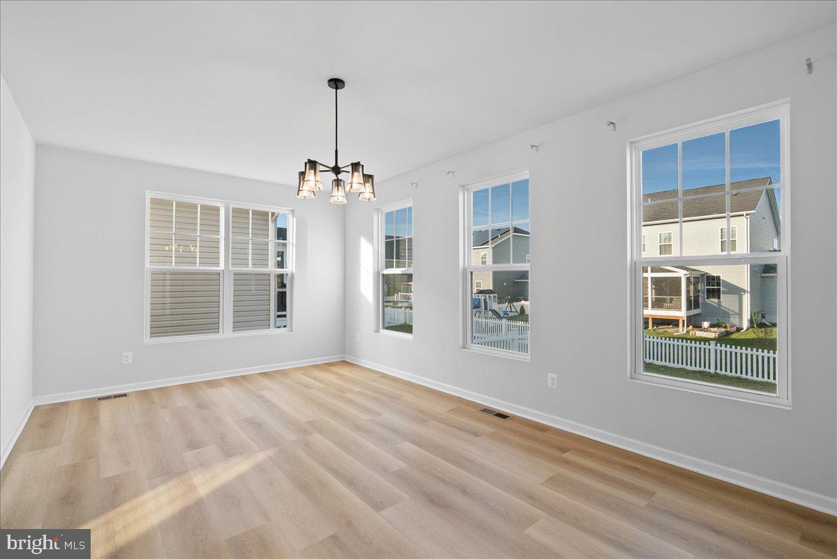 115 Interlace Way Stephenson, VA 22656 - Photo 13 of 45 a view of an empty room with windows
