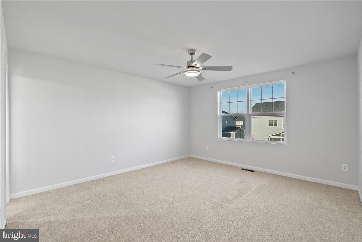 115 Interlace Way Stephenson, VA 22656 - Photo 26 of 45 an empty room with a empty space and a ceiling fan