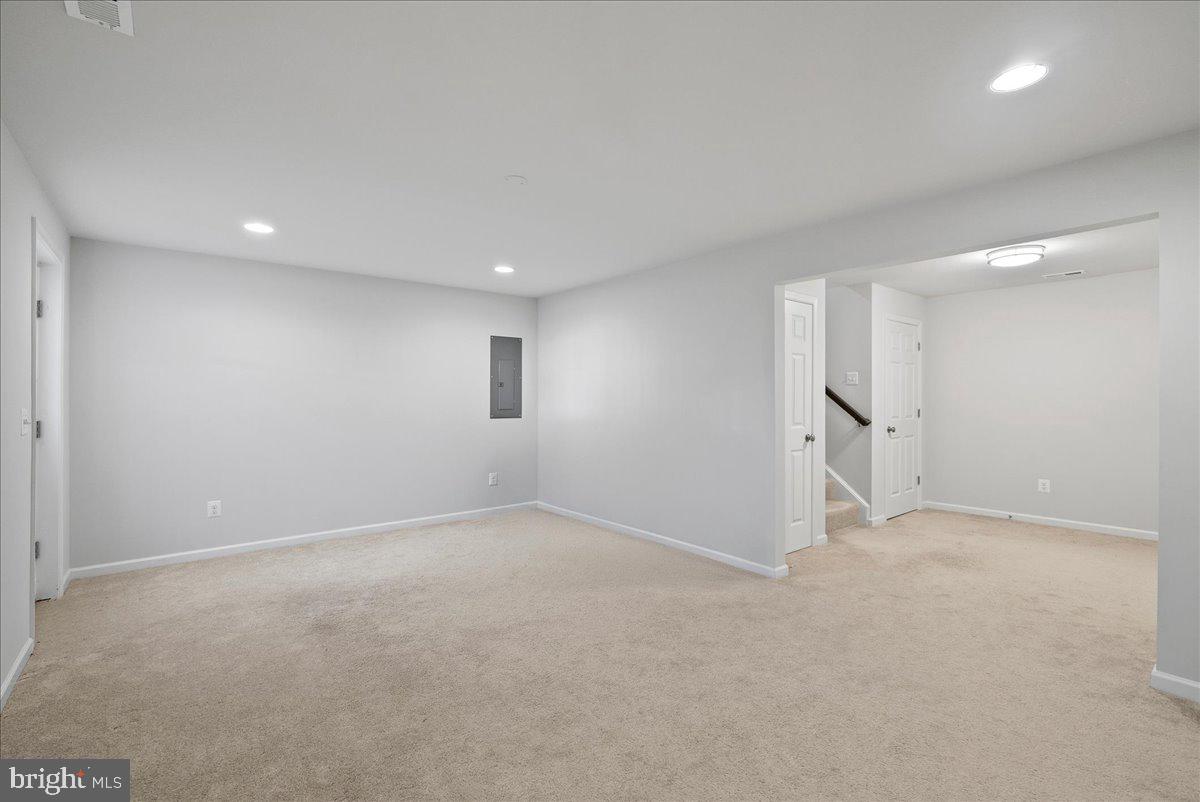 115 Interlace Way Stephenson, VA 22656 - Photo 30 of 45 an empty room with a empty space and windows