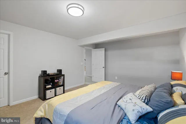 a bedroom with a bed and dresser