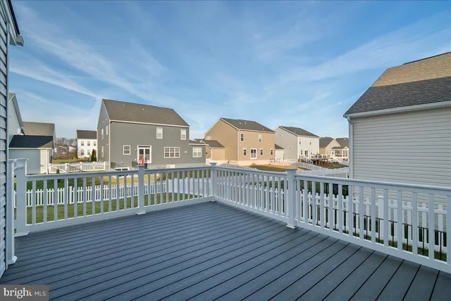 a view of balcony with wooden floor