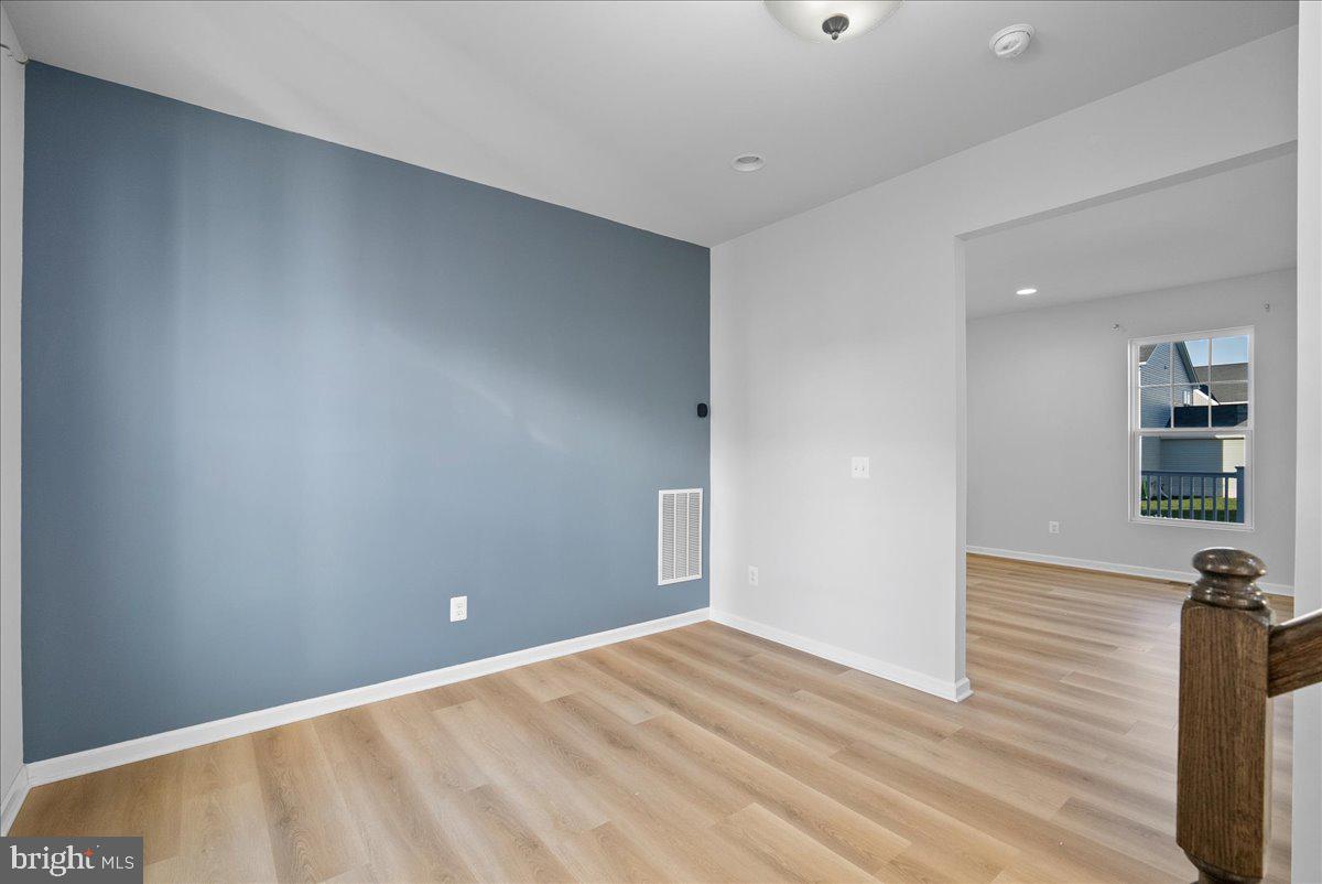 115 Interlace Way Stephenson, VA 22656 - Photo 5 of 45 a view of an empty room with wooden floor