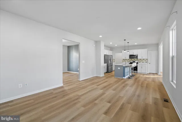 a view of kitchen with wooden floor