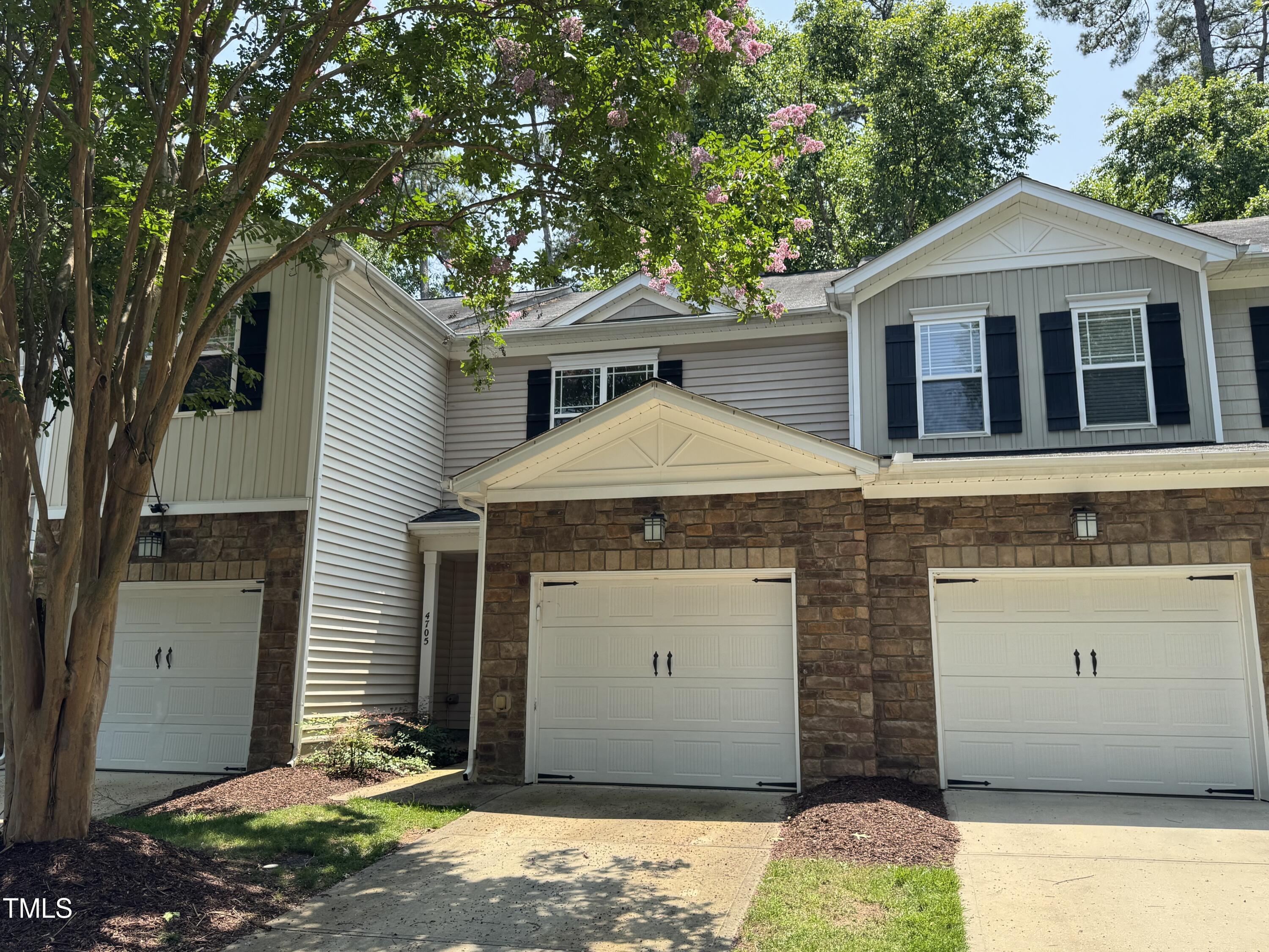 4705 Lawhorn Street Raleigh, NC 27606 - Photo 1 of 9 a front view of a house with a yard