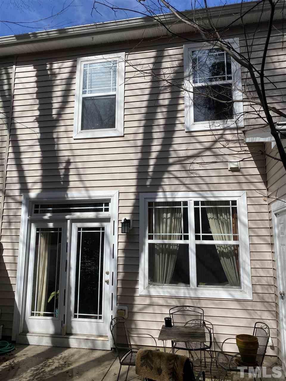 4705 Lawhorn Street Raleigh, NC 27606 - Photo 12 of 13 a view of a house with a door and balcony