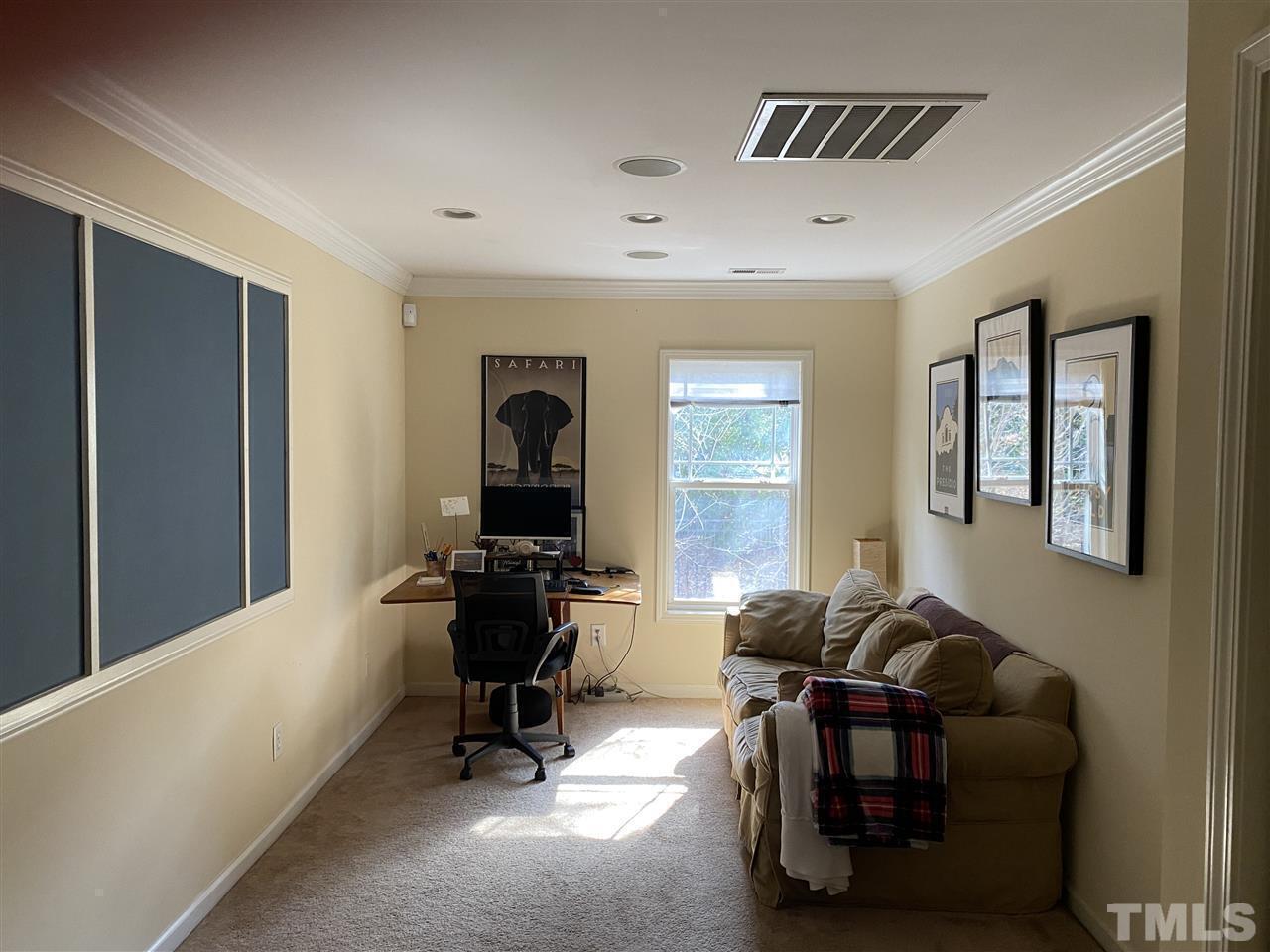 4705 Lawhorn Street Raleigh, NC 27606 - Photo 4 of 9 a living room with furniture and a window