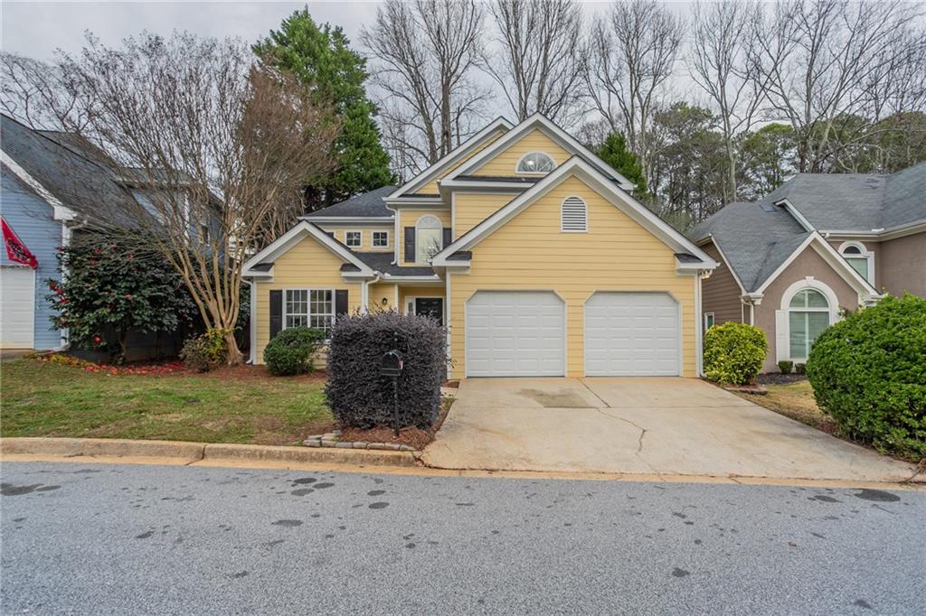 2858 Royal Bluff Decatur, GA 30030 - Photo 1 of 1 a front view of a house with a yard and garage