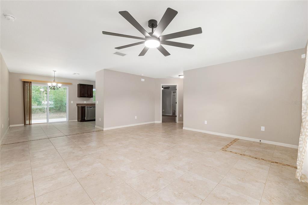 2 Hemlock Loop Drive Ocala, FL 34472 - Photo 6 of 28 an empty room with ceiling fan and window