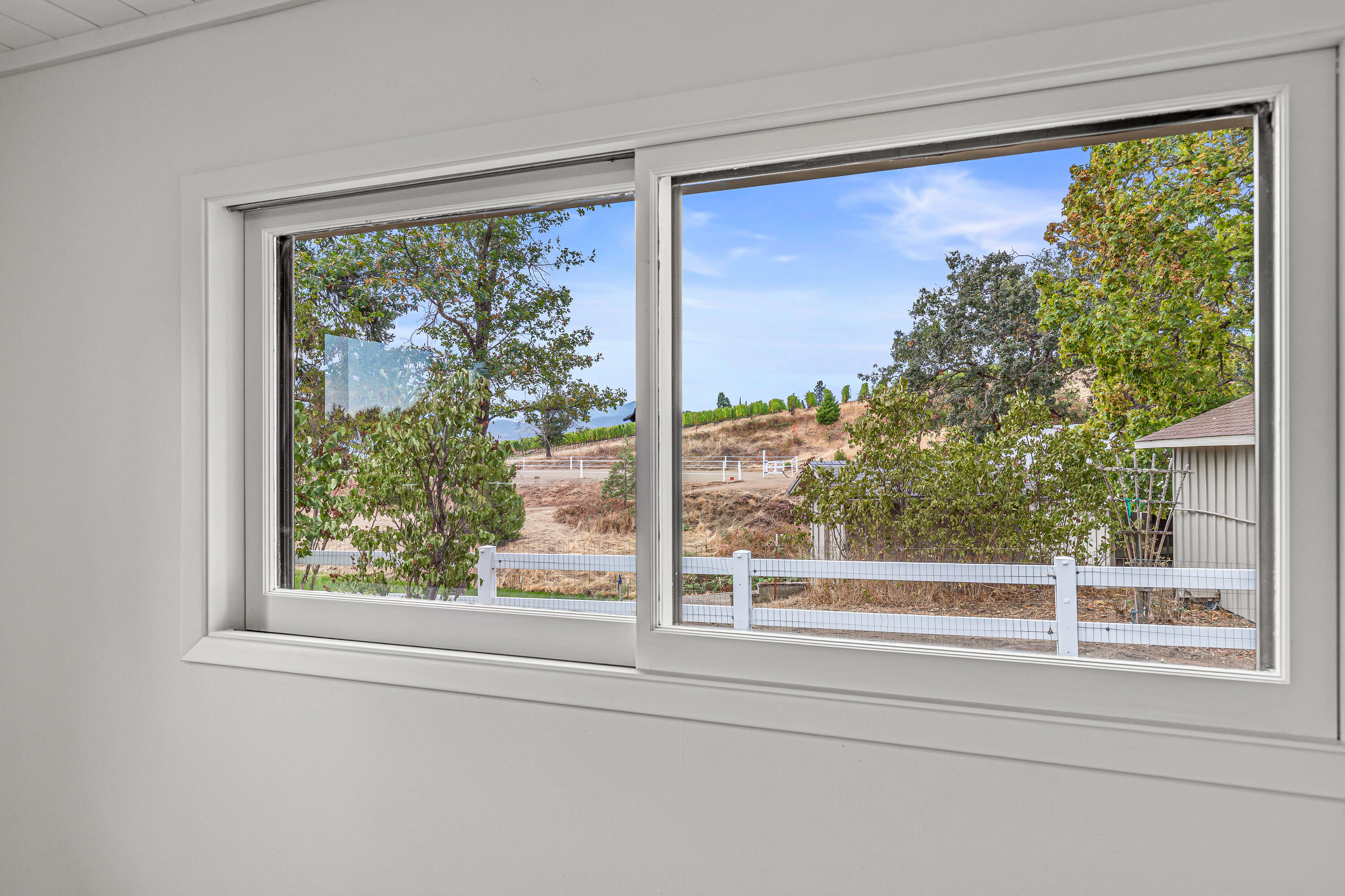 1865 Old Military Road Central Point, OR 97502 - Photo 42 of 77 a view of a room that has a large window and a bed