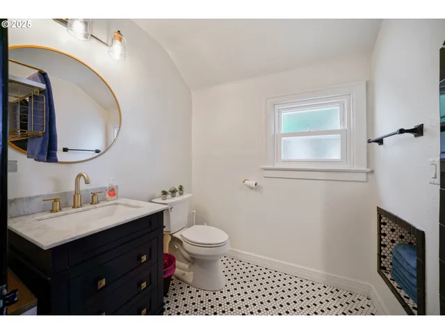 a kitchen with a sink and a mirror