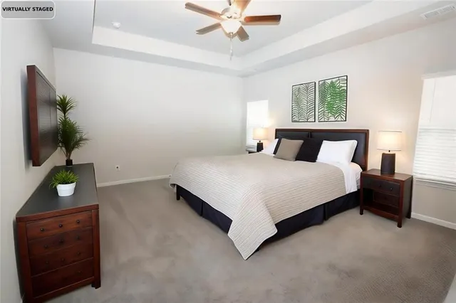 a bedroom with a bed and a dresser