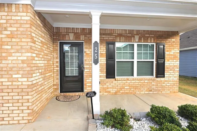 a view of a brick house with an outdoor space