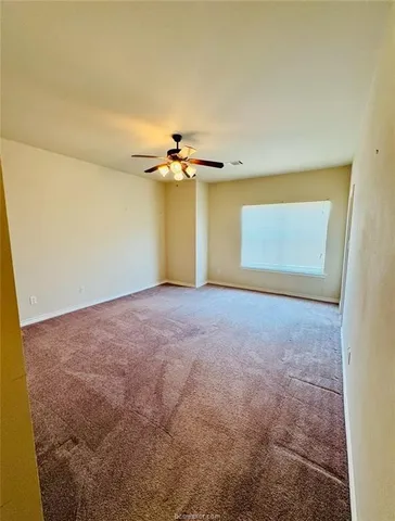 a bathroom with a granite countertop sink a mirror and a bathtub
