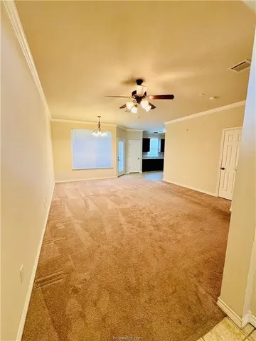 a view of a big room with closet and chandelier fan