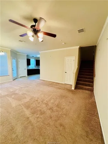 a view of an empty room with a fireplace
