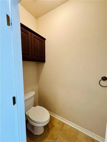 a bathroom with a toilet
