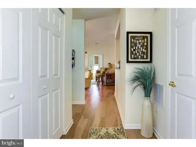 a view of a living room and hardwood floor