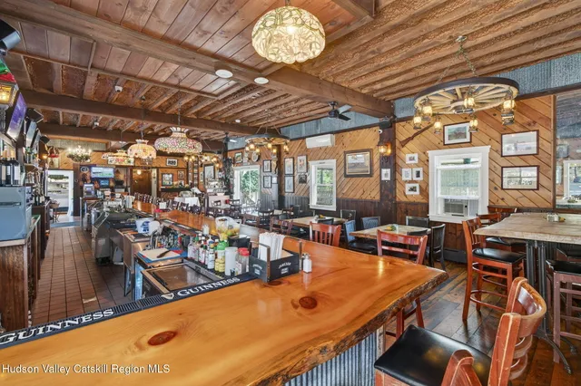 a bath room with a sink and furniture