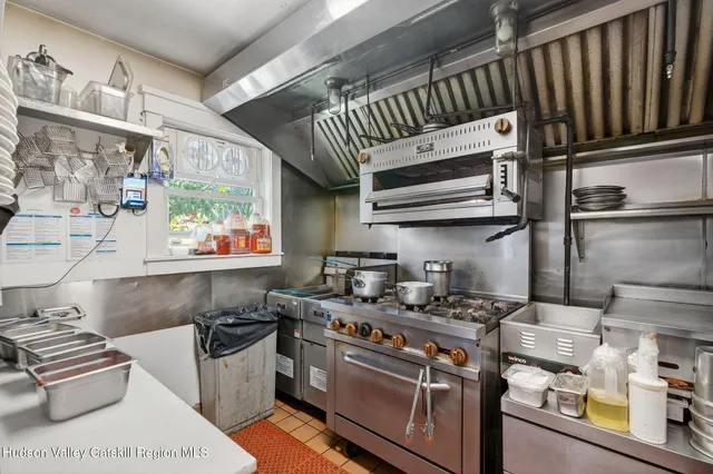 a view of a patio with table and chairs and potted plants