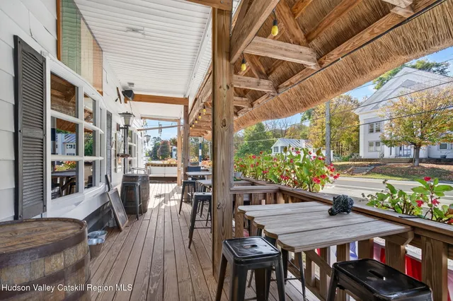 a view of an entryway wooden floor and chandelier