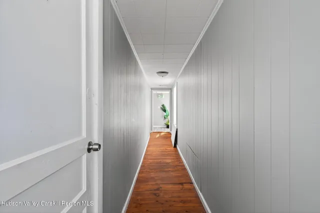 an aerial view of residential house with outdoor space and parking
