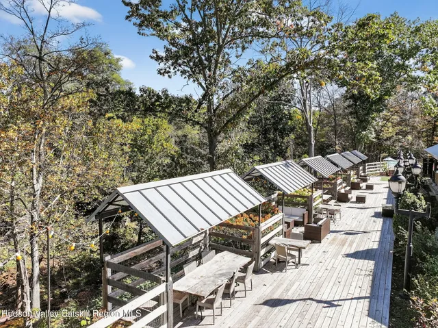 a view of a chairs and table in patio