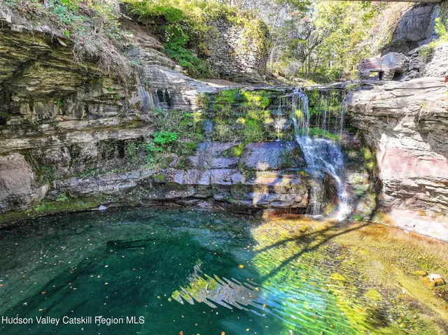 a view of a patio with table and chairs and potted plants