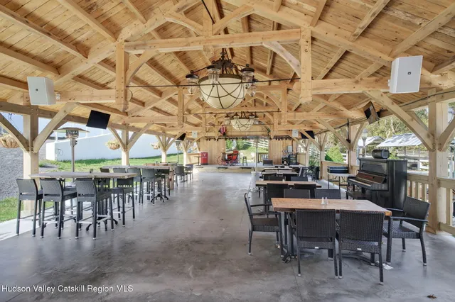 a view of a chair and table in backyard