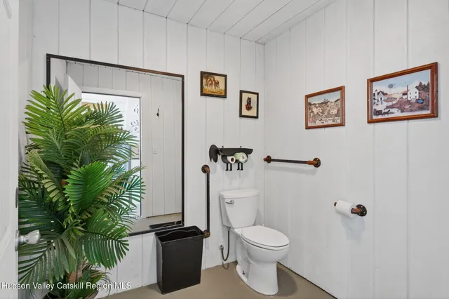 a front view of a house with sitting area and entertaining space