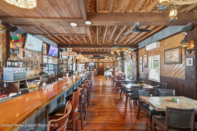 a outdoor dining space with furniture and a potted plant