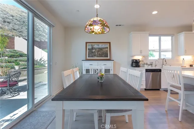 a view of a dining room with furniture and window