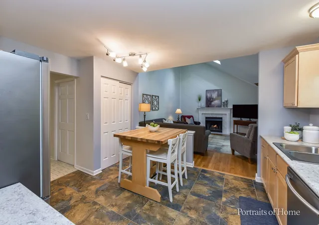 a kitchen with a table and chairs in it