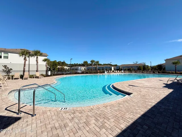 a view of a lake with outdoor seating
