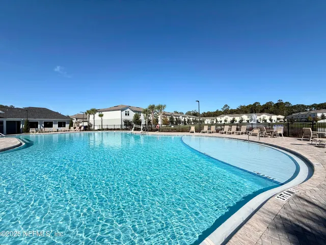 a view of swimming pool from a balcony