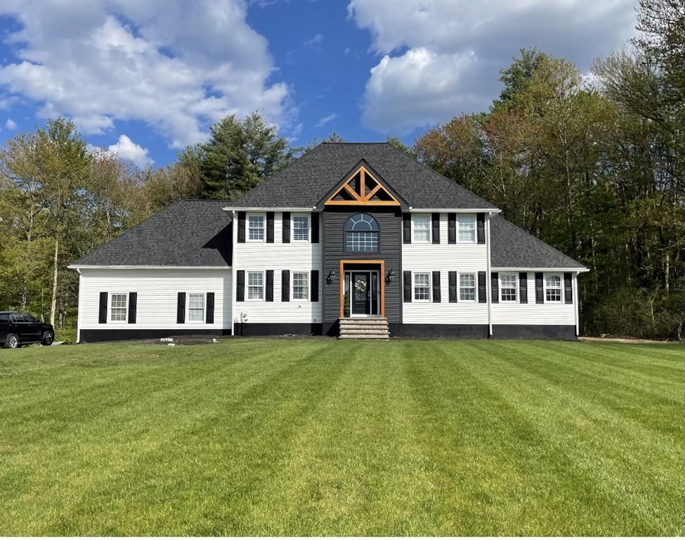 11 Woodman Road Amesbury, MA 01913 - Photo 1 of 31 a white house with a large pool in front of it
