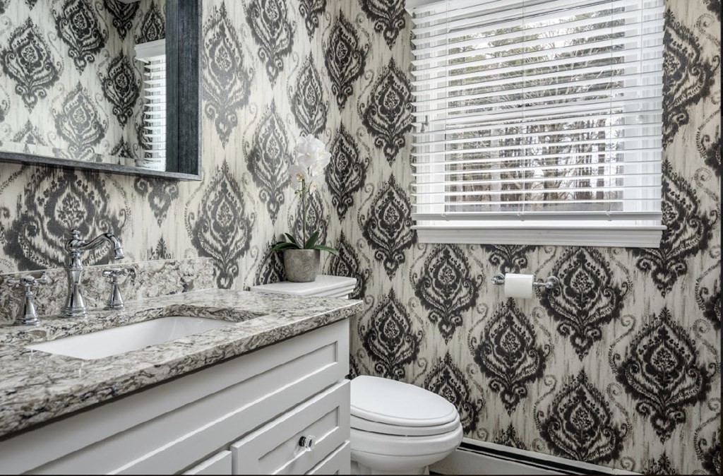 11 Woodman Road Amesbury, MA 01913 - Photo 11 of 31 a bathroom with a granite countertop sink and a toilet